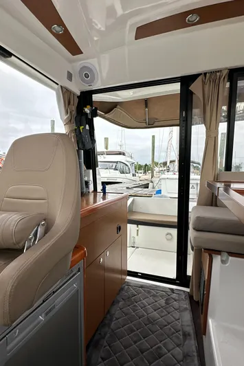Something Special Yacht Photos Pics Interior of 2016 Jeanneau Merry Fisher 855 boat with open sliding door.