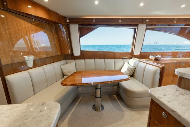Galati Yacht Sales Trade Yacht Photos Pics Luxurious interior of 2020 Viking 62 Convertible yacht with ocean view.