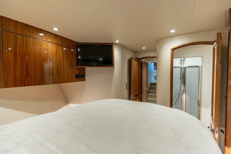 Galati Yacht Sales Trade Yacht Photos Pics Luxurious interior of 2020 Viking 62 Convertible yacht with wood accents and modern amenities.