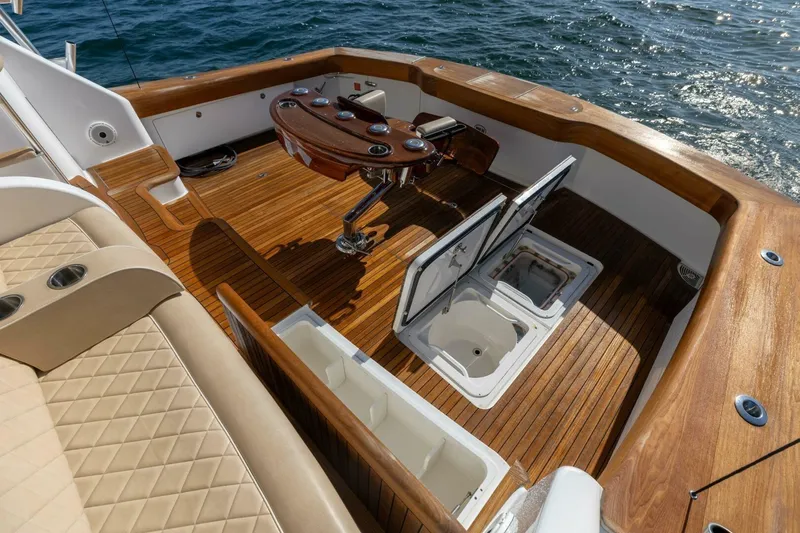 Galati Yacht Sales Trade Yacht Photos Pics Luxurious 2020 Viking 62 Convertible yacht deck with wood finish and ocean view.