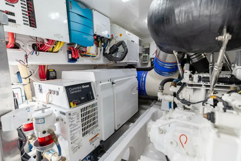 Galati Yacht Sales Trade Yacht Photos Pics Engine room of 2020 Viking 62 Convertible yacht with Cummins Onan generator and wiring.