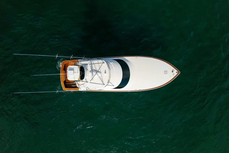 Galati Yacht Sales Trade Yacht Photos Pics Aerial view of 2020 Viking 62 Convertible yacht on green water.