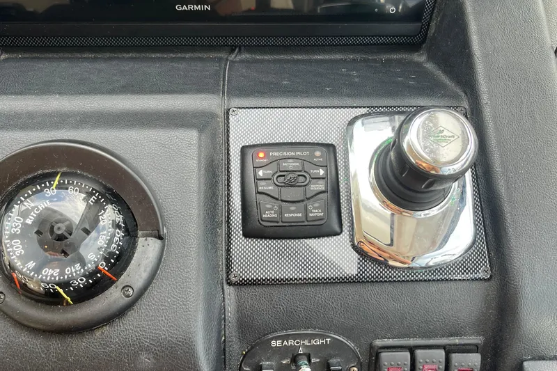  Yacht Photos Pics Control panel of a 2015 Riviera 5000 Sport Yacht with compass and joystick.