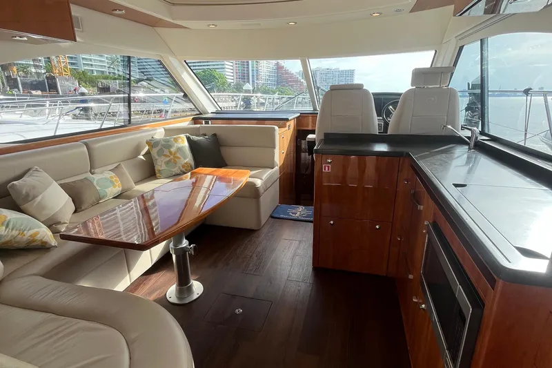  Yacht Photos Pics Luxurious interior of 2015 Riviera 5000 Sport Yacht with elegant seating and modern amenities.