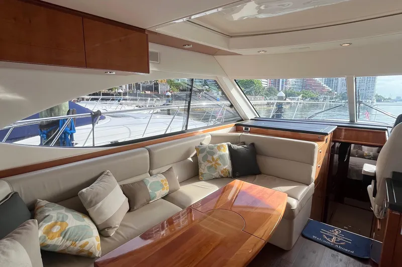  Yacht Photos Pics Luxurious interior of 2015 Riviera 5000 Sport Yacht with plush seating and scenic windows.