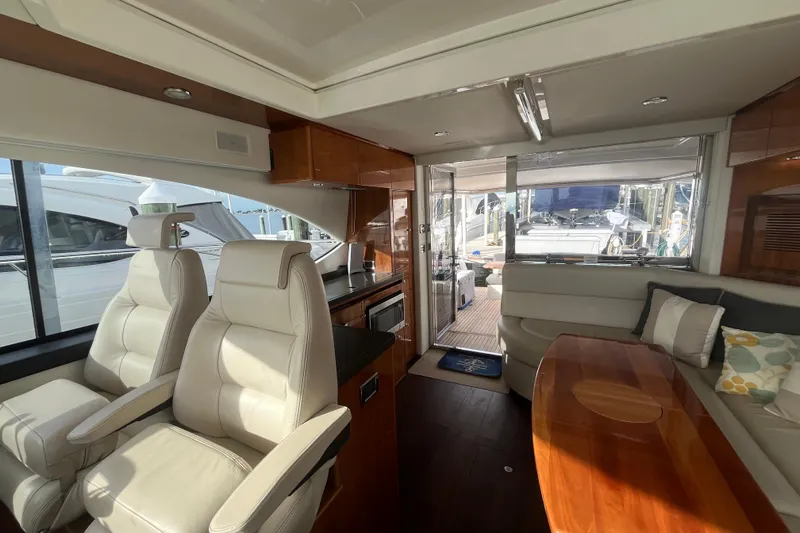  Yacht Photos Pics Luxurious interior of 2015 Riviera 5000 Sport Yacht with plush seating and modern amenities.