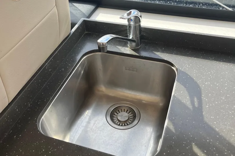  Yacht Photos Pics Stainless steel sink and faucet on 2015 Riviera 5000 Sport Yacht.
