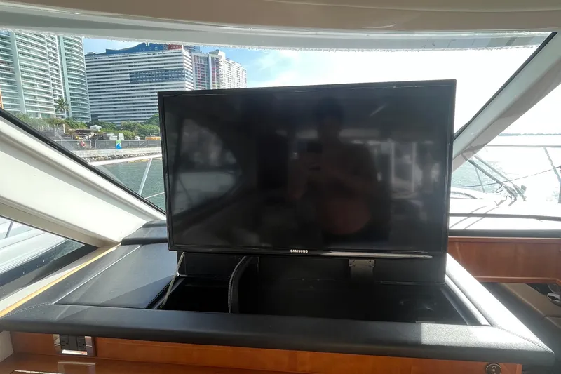  Yacht Photos Pics 2015 Riviera 5000 Sport Yacht interior with Samsung TV, cityscape view.