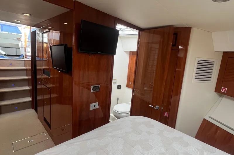  Yacht Photos Pics Interior of 2015 Riviera 5000 Sport Yacht with wood paneling and modern amenities.
