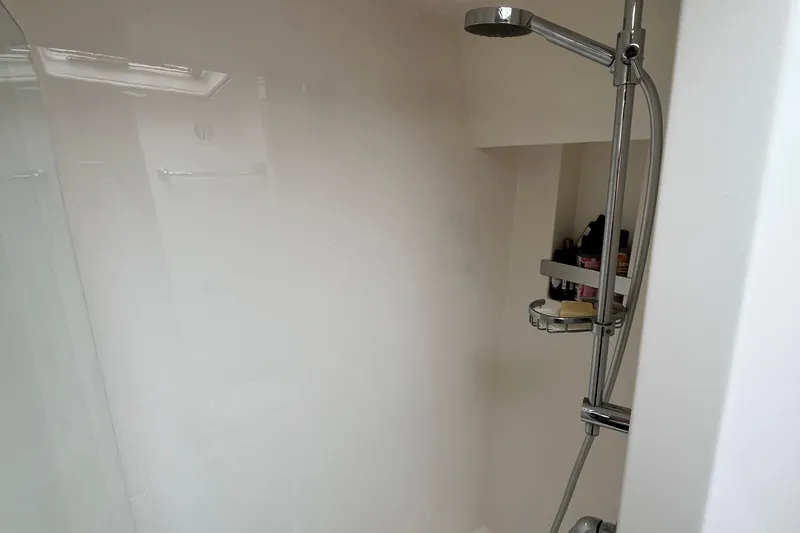  Yacht Photos Pics Shower area in 2015 Riviera 5000 Sport Yacht with chrome fixtures and toiletries.