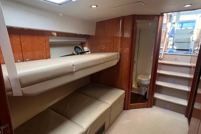  Yacht Photos Pics Interior of 2015 Riviera 5000 Sport Yacht with bunk beds and bathroom.