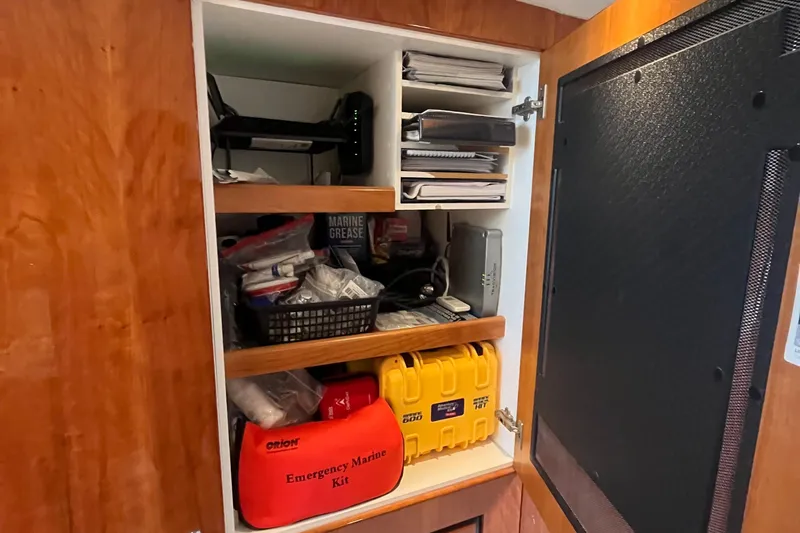  Yacht Photos Pics Cabinet storage on 2015 Riviera 5000 Sport Yacht with emergency marine kit and supplies.