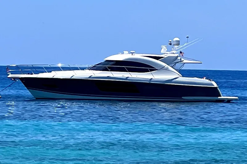  Yacht Photos Pics 2015 Riviera 5000 Sport Yacht on clear blue ocean waters.