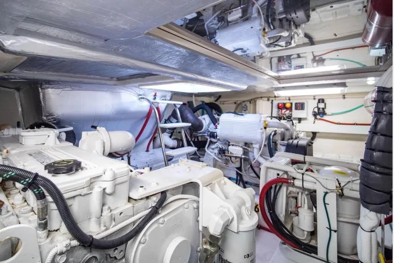  Yacht Photos Pics Engine room of 2015 Riviera 5000 Sport Yacht, showcasing mechanical components and systems.