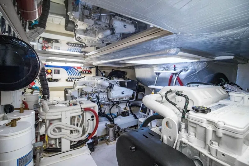  Yacht Photos Pics Engine room of 2015 Riviera 5000 Sport Yacht, showcasing mechanical components and systems.
