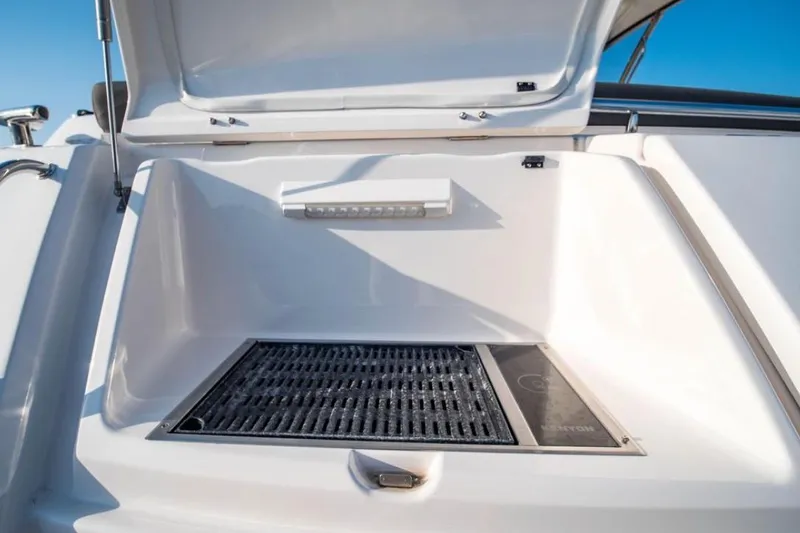  Yacht Photos Pics Open storage compartment on 2015 Riviera 5000 Sport Yacht, featuring a sleek design.