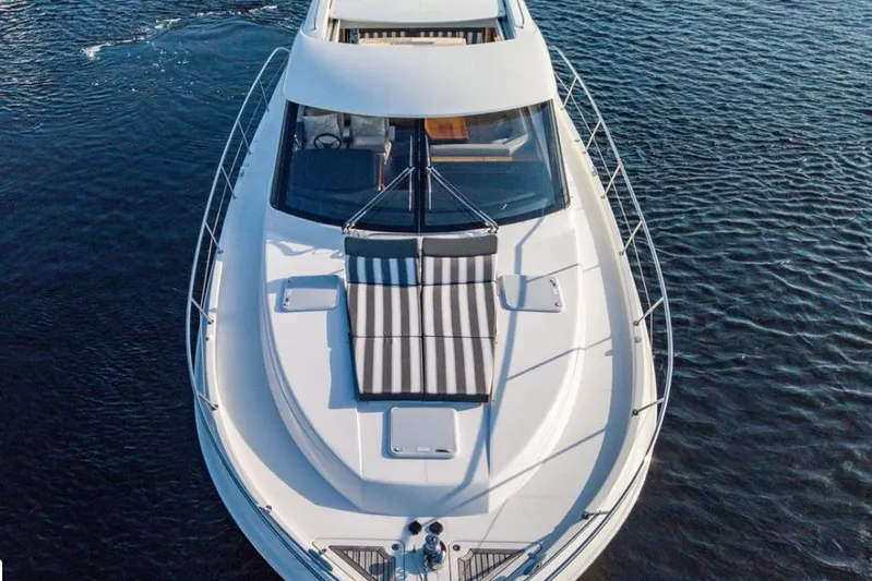  Yacht Photos Pics 2015 Riviera 5000 Sport Yacht on calm water, aerial view.