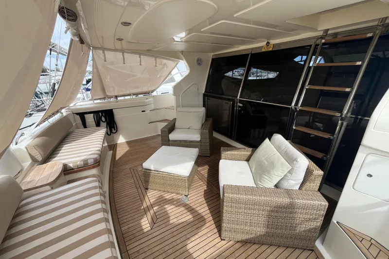  Yacht Photos Pics Luxurious 2010 Ferretti Yachts 620 interior with elegant seating and teak flooring.