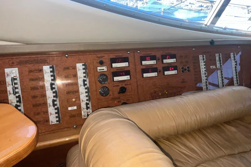  Yacht Photos Pics Control panel of a 2010 Ferretti Yachts 620, featuring gauges and switches.