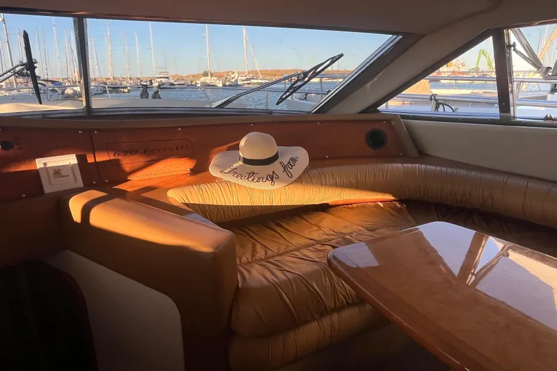  Yacht Photos Pics Luxurious interior of 2010 Ferretti Yachts 620 with marina view and elegant decor.