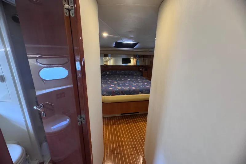  Yacht Photos Pics Luxurious cabin interior of 2010 Ferretti Yachts 620 with wooden flooring.