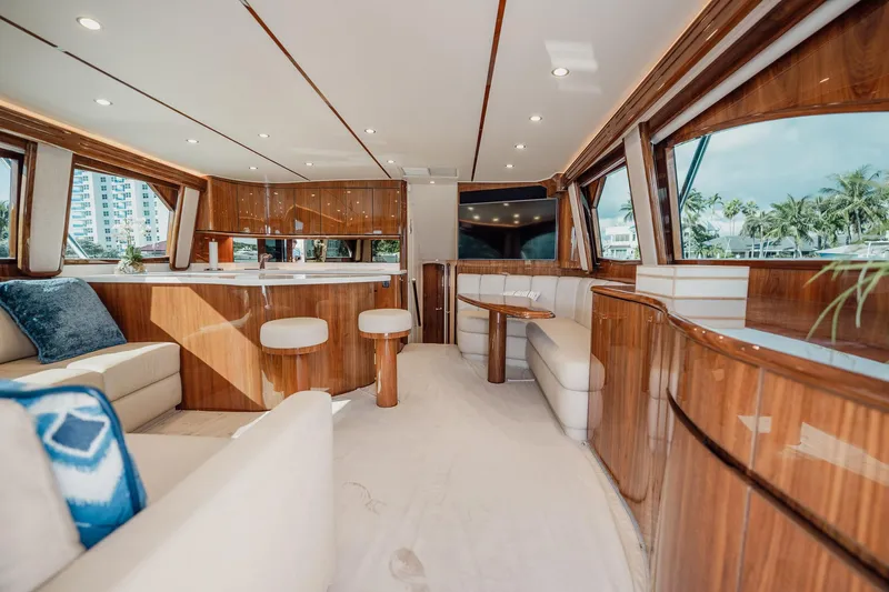 Lori A Yacht Photos Pics Luxurious interior of 2021 Viking 54 Convertible yacht with elegant wood finishes and plush seating.