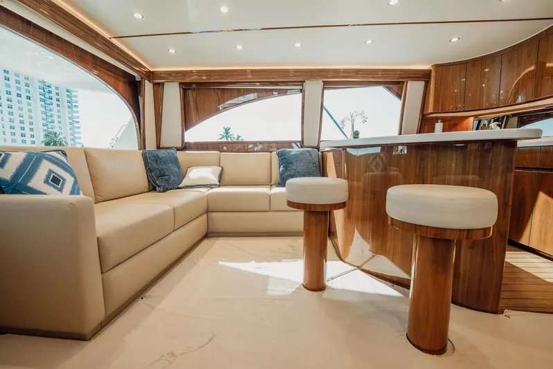 Lori A Yacht Photos Pics Luxurious interior of 2021 Viking 54 Convertible yacht with plush seating and elegant wood finishes.