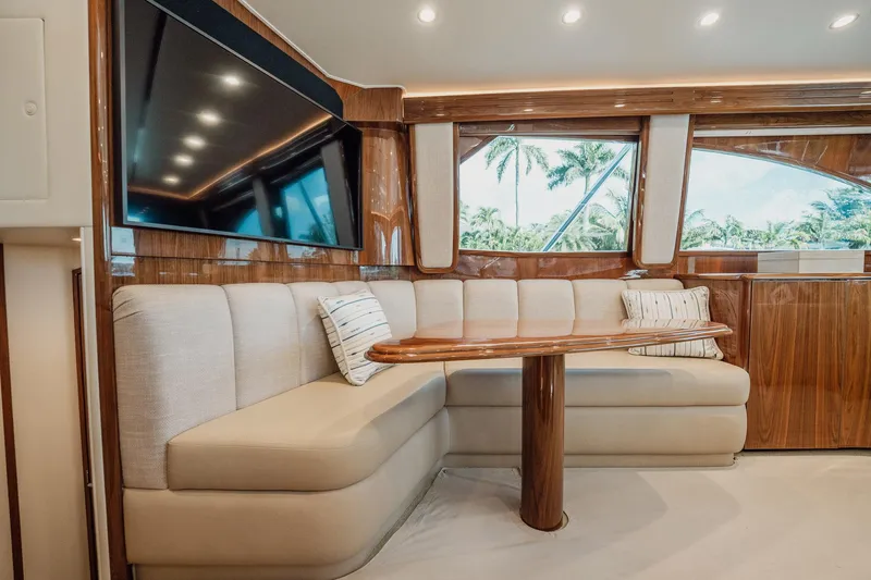 Lori A Yacht Photos Pics Luxurious interior of 2021 Viking 54 Convertible yacht with plush seating and elegant wood finishes.