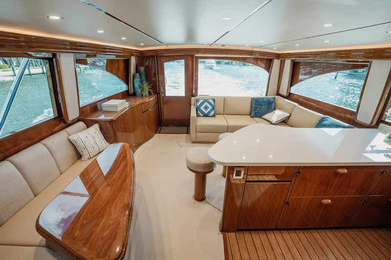 Lori A Yacht Photos Pics Luxurious interior of 2021 Viking 54 Convertible yacht with elegant wood finishes and plush seating.