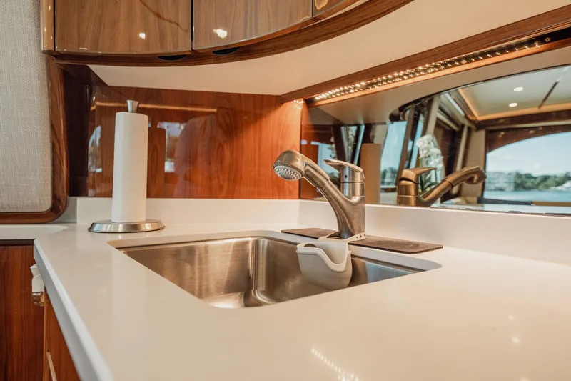 Lori A Yacht Photos Pics Luxurious kitchen sink area in 2021 Viking 54 Convertible yacht interior.