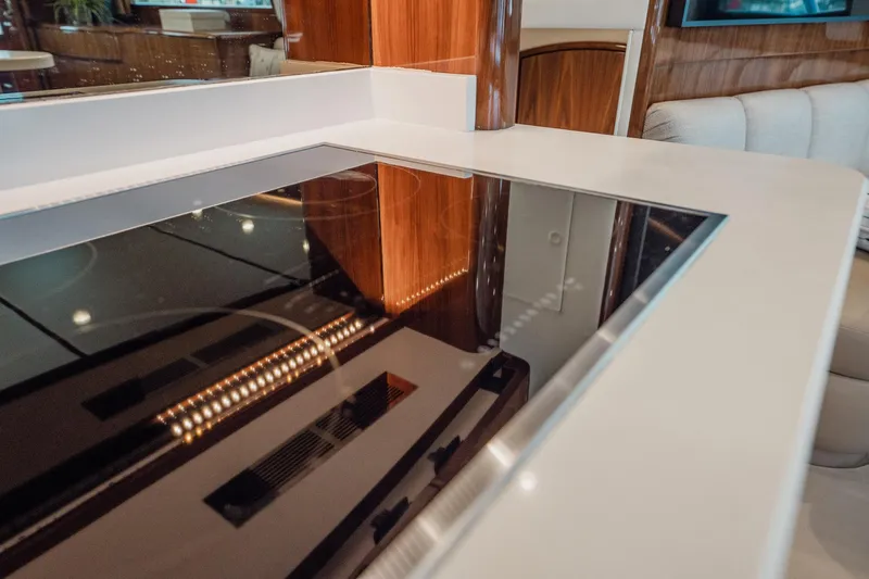 Lori A Yacht Photos Pics Modern kitchen interior of 2021 Viking 54 Convertible yacht with sleek countertop.