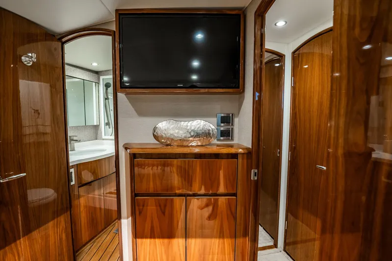 Lori A Yacht Photos Pics Luxurious interior of 2021 Viking 54 Convertible yacht with wood finish and modern amenities.