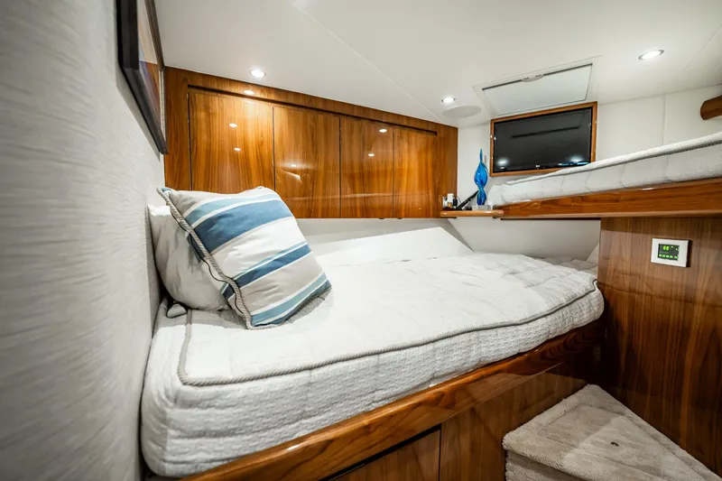 Lori A Yacht Photos Pics Luxurious cabin interior of 2021 Viking 54 Convertible yacht with wooden finishes.