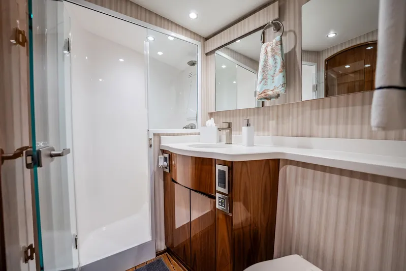 Lori A Yacht Photos Pics Luxurious bathroom in 2021 Viking 54 Convertible yacht with modern fixtures and elegant design.