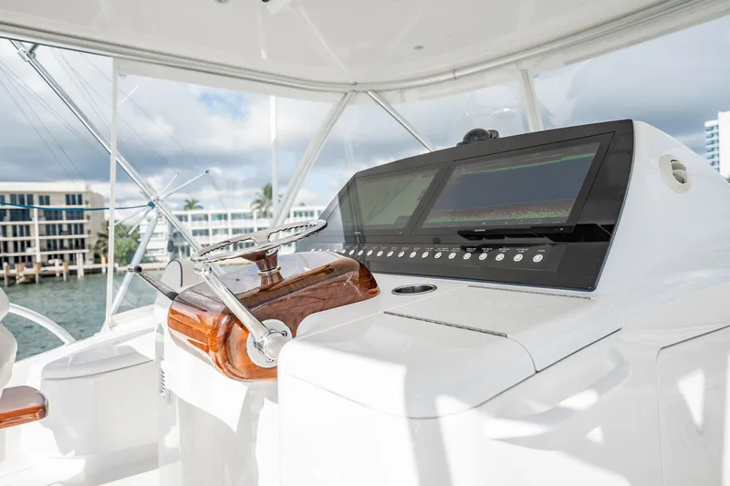 Lori A Yacht Photos Pics 2021 Viking 54 Convertible yacht helm with modern navigation displays and controls.