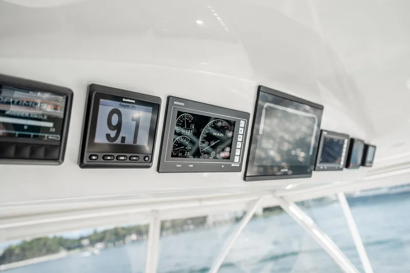 Lori A Yacht Photos Pics Dashboard of 2021 Viking 54 Convertible yacht with navigation displays.