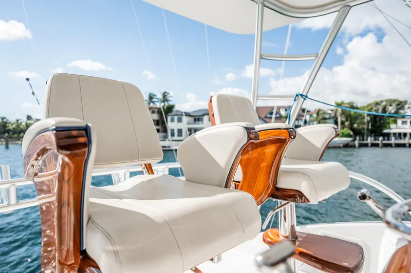 Lori A Yacht Photos Pics Luxury seating on 2021 Viking 54 Convertible yacht, with waterfront view.