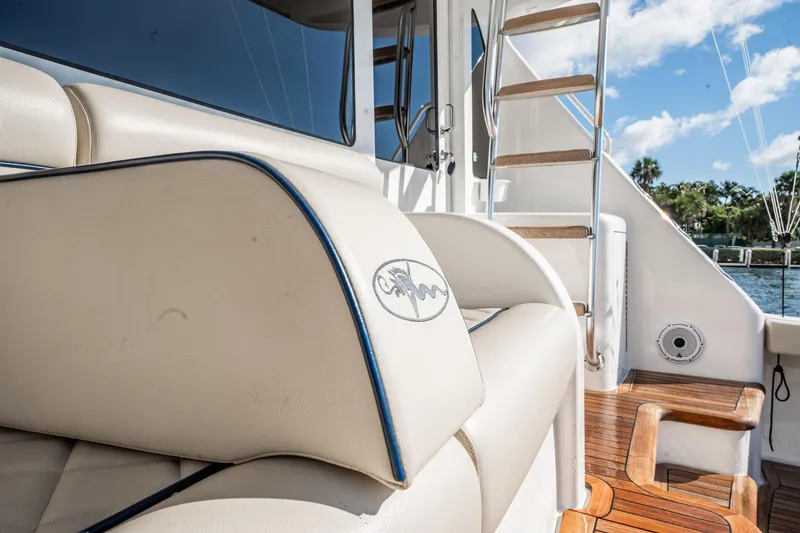 Lori A Yacht Photos Pics Luxury seating and wooden steps on a 2021 Viking 54 Convertible yacht.
