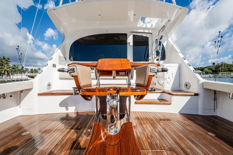 Lori A Yacht Photos Pics Luxurious 2021 Viking 54 Convertible yacht with polished wood deck and seating.