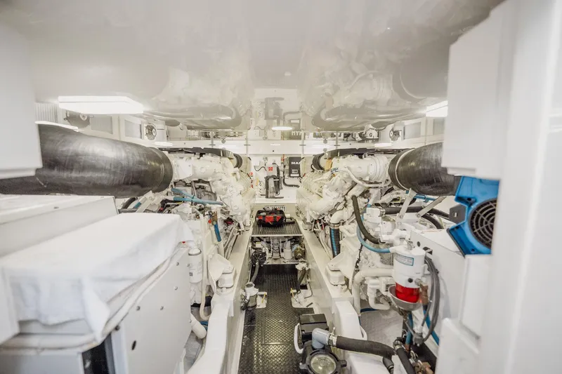 Lori A Yacht Photos Pics Engine room of 2021 Viking 54 Convertible yacht, showcasing dual engines and mechanical systems.