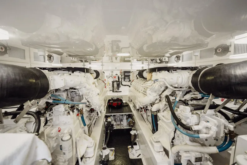 Lori A Yacht Photos Pics Engine room of 2021 Viking 54 Convertible yacht, showcasing powerful machinery and clean design.