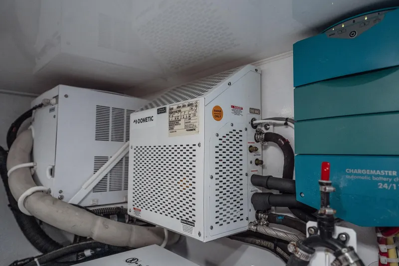 Lori A Yacht Photos Pics Engine room of 2021 Viking 54 Convertible with Dometic and battery charger systems.