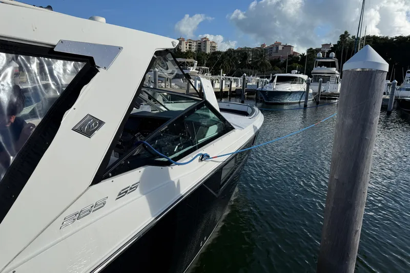  Yacht Photos Pics 2022 Monterey 385SS Super Sport boat docked at marina, clear sky background.