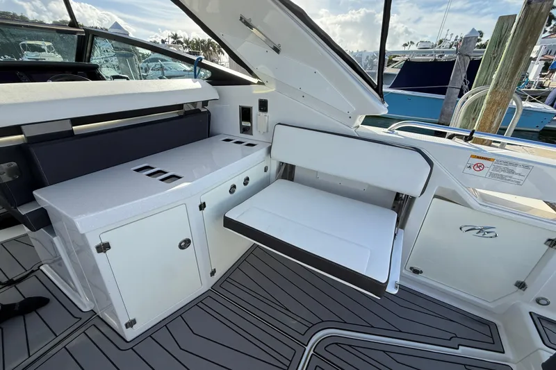  Yacht Photos Pics 2022 Monterey 385SS Super Sport boat interior with seating and storage compartments.