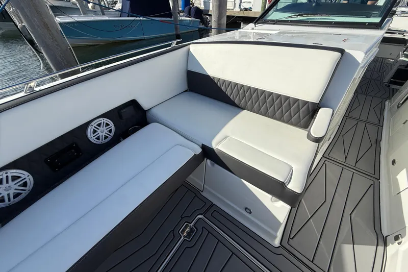  Yacht Photos Pics 2022 Monterey 385SS Super Sport boat interior with cushioned seating and marine speakers.