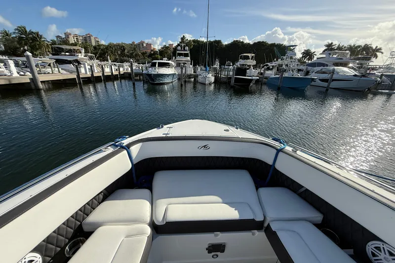  Yacht Photos Pics 2022 Monterey 385SS Super Sport boat docked in a marina under a clear blue sky.