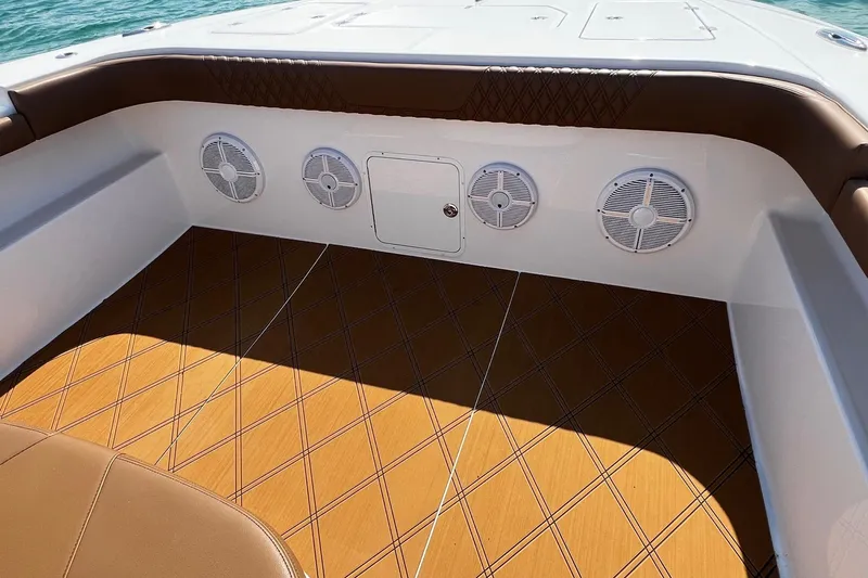  Yacht Photos Pics 2024 Invincible 46 Catamaran interior with speakers and stylish flooring.