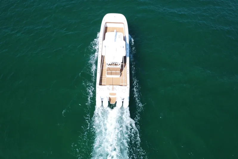  Yacht Photos Pics Aerial view of 2024 Invincible 46 Catamaran cruising on open water.