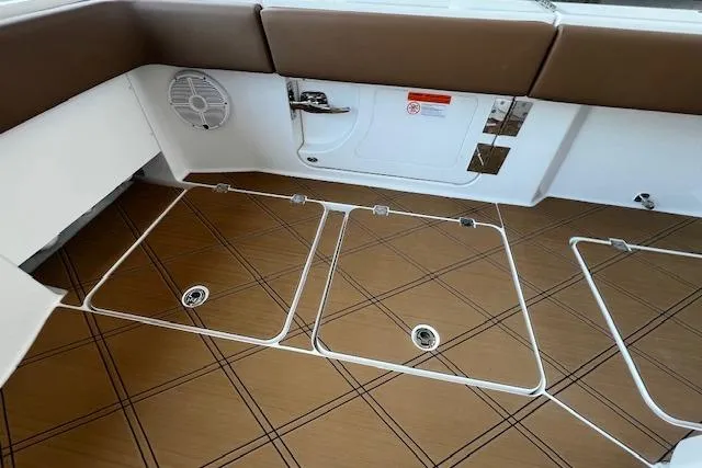  Yacht Photos Pics 2024 Invincible 46 Catamaran interior with brown flooring and storage compartments.