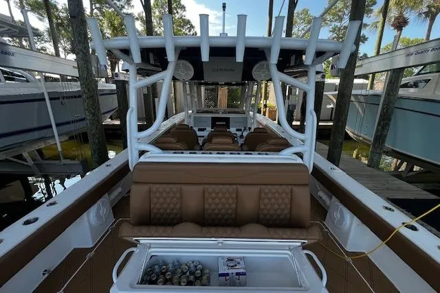  Yacht Photos Pics 2024 Invincible 46 Catamaran with luxurious seating and modern amenities docked in a marina.